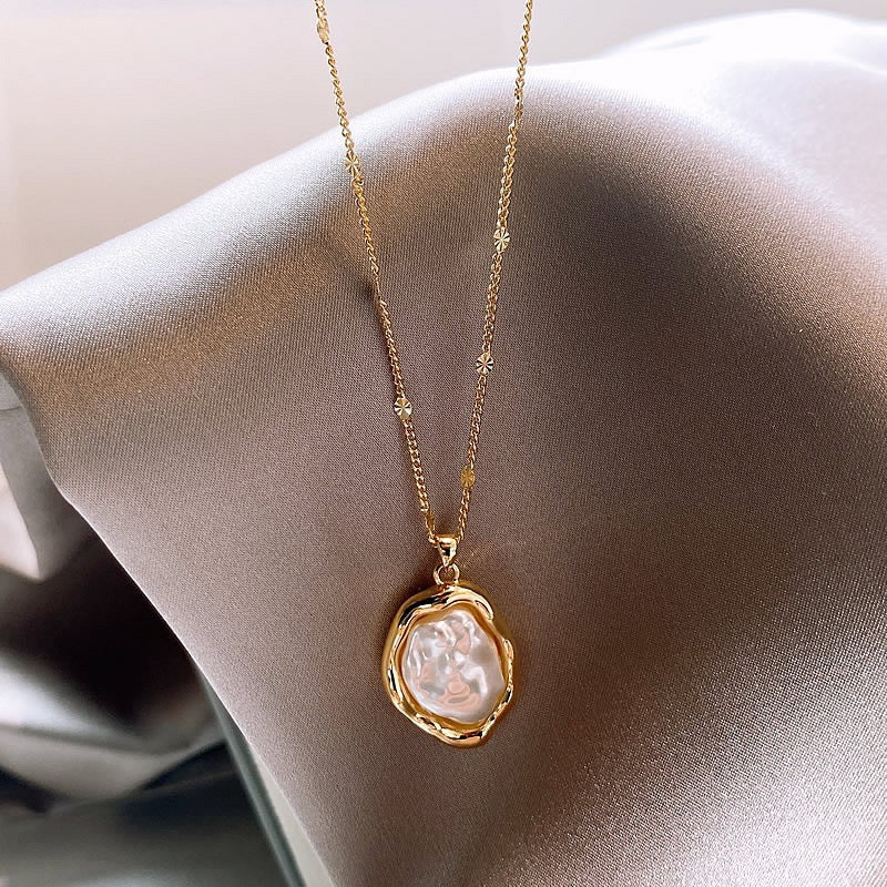 Close-up of baroque pearl pendant necklace