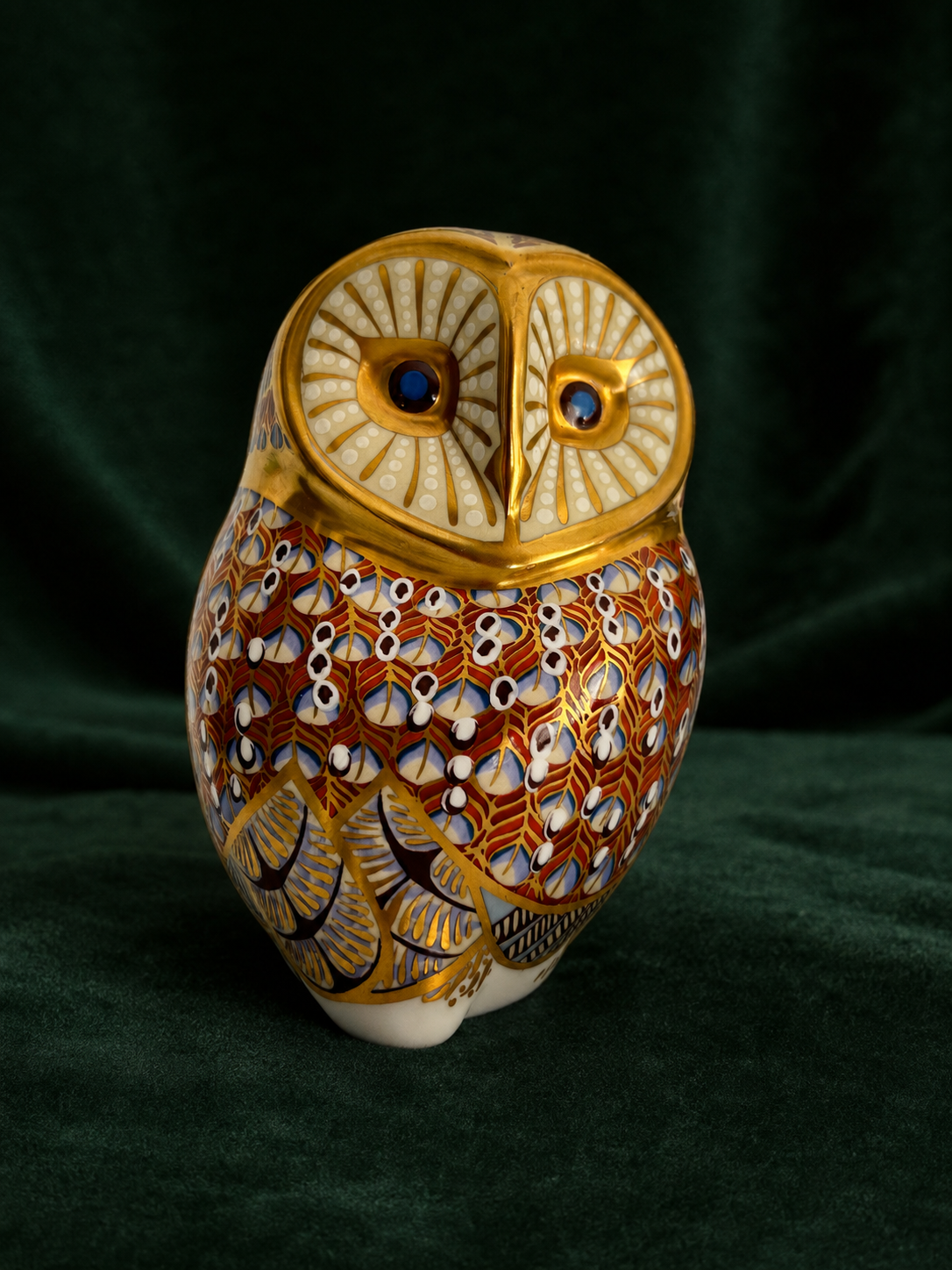 Royal Crown Derby Barn Owl paperweight front view on deep green velvet