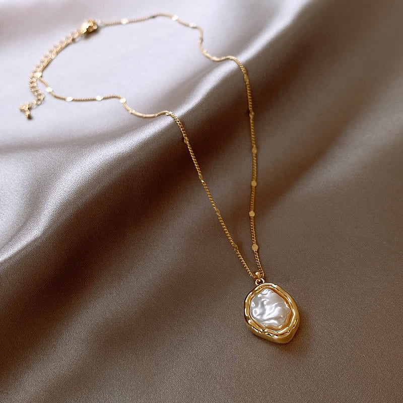 Baroque pearl gold-plated necklace on satin