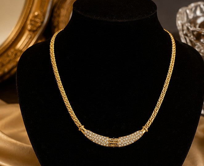 Crystal pavé gold-plated necklace on black velvet display