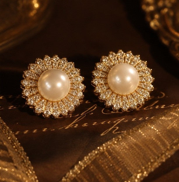 Pearl zircon floral stud earrings on dark background
