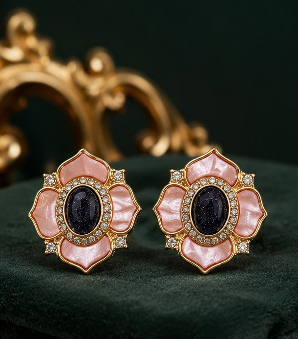 Pink mother-of-pearl camellia stud earrings front view