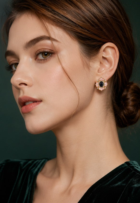 Model wearing pink mother-of-pearl camellia stud earrings