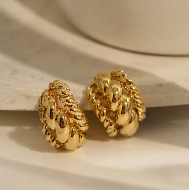 Side view of gold-plated sculpted rope stud earrings