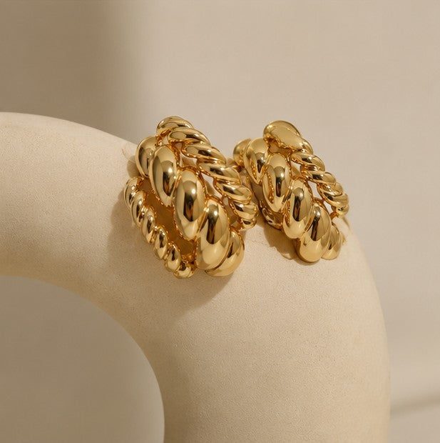Close-up of gold-plated rope texture stud earrings