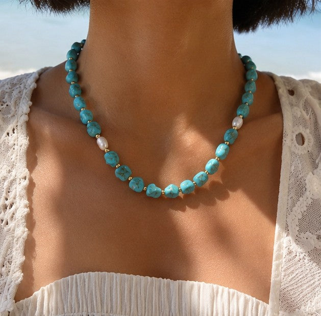 Turquoise-color beaded necklace worn